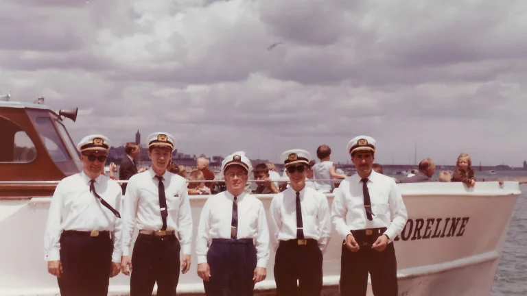 Shoreline Sightseeing crew, 1939 — founding captains in uniform in front of an early Shoreline Sightseeing boat